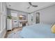 This bedroom has neutral gray walls, wood flooring, and a mounted TV in the center at 2336 Tidewatch Way, North Myrtle Beach, SC 29582