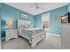 Comfortable bedroom features a queen bed with blue accents, a nightstand, and a ceiling fan at 2336 Tidewatch Way, North Myrtle Beach, SC 29582