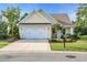 Charming single-story home featuring a two-car garage, well-maintained lawn, and tasteful landscaping at 2336 Tidewatch Way, North Myrtle Beach, SC 29582