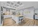 Spacious kitchen features a center island with barstool seating and modern, stainless steel appliances at 2336 Tidewatch Way, North Myrtle Beach, SC 29582