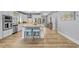 Bright, open kitchen boasts a center island with seating, stainless steel appliances, and granite countertops at 2336 Tidewatch Way, North Myrtle Beach, SC 29582
