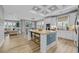 Open concept kitchen has an island with seating and flows into the living and dining areas at 2336 Tidewatch Way, North Myrtle Beach, SC 29582