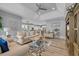 Open-concept living room with modern furnishings, stylish decor, and seamless flow to the kitchen at 2336 Tidewatch Way, North Myrtle Beach, SC 29582