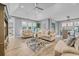 Bright living room featuring vaulted ceilings, comfortable sofas, and views to the dining area at 2336 Tidewatch Way, North Myrtle Beach, SC 29582
