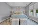 A spacious main bedroom featuring a king bed with bedside tables and an ornate area rug at 2336 Tidewatch Way, North Myrtle Beach, SC 29582