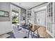 Bright office features a modern desk, comfortable chair, and views of the landscaped front yard at 2336 Tidewatch Way, North Myrtle Beach, SC 29582