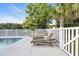 Outdoor kitchen and pool area with lounge chairs and a grill at 2336 Tidewatch Way, North Myrtle Beach, SC 29582