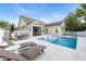 Backyard with pool, lounge chairs, and outdoor seating area at 2336 Tidewatch Way, North Myrtle Beach, SC 29582