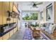 Covered patio featuring outdoor wicker furniture, a television, and an electric fireplace at 2336 Tidewatch Way, North Myrtle Beach, SC 29582