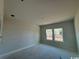 Bright bedroom with natural light streaming through two large windows, creating a welcoming and serene space at 3012 Palma Way, Myrtle Beach, SC 29579