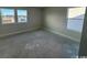 A bright bedroom with two windows providing ample natural light and views at 3012 Palma Way, Myrtle Beach, SC 29579