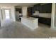 Modern kitchen with stainless steel appliances, a large island, and sleek gray cabinets, offering style and functionality at 3012 Palma Way, Myrtle Beach, SC 29579