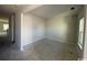 Unfinished living room offers a blank canvas with bright lighting and a view of the property's yard at 3012 Palma Way, Myrtle Beach, SC 29579