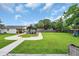 Expansive backyard features lush grass, a wooden gazebo, and mature trees, perfect for outdoor activities at 312 S Poplar Ave., Andrews, SC 29510