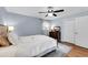 Comfortable bedroom featuring natural light, hardwood floors, and classic accents at 312 S Poplar Ave., Andrews, SC 29510