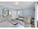 Charming bedroom features a beadboard ceiling, wood floors, and a lovely chair for a serene space at 312 S Poplar Ave., Andrews, SC 29510