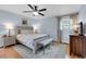 Serene bedroom with a full-sized bed, stylish furnishings, and soft, neutral tones at 312 S Poplar Ave., Andrews, SC 29510