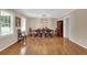 A formal dining room showcases hardwood floors, and a large window with natural light at 312 S Poplar Ave., Andrews, SC 29510
