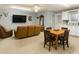 Cozy living room with comfortable seating, neutral decor, and a dining area with table and chairs at 312 S Poplar Ave., Andrews, SC 29510