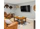 Inviting living room with leather furniture, mounted TV, and decorative accents for a relaxed atmosphere at 312 S Poplar Ave., Andrews, SC 29510