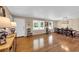 Living and dining area with hardwood floors, neutral walls and a window with natural light at 312 S Poplar Ave., Andrews, SC 29510