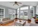 Spacious playroom with hardwood floors, light-colored furniture, and lots of bright windows at 312 S Poplar Ave., Andrews, SC 29510