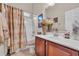 Traditional bathroom featuring a vanity with a mirror, floral arrangement, and a shower-tub combination at 327 Trestle Way, Conway, SC 29526
