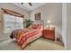 Bedroom with a wrought iron bed frame, a window with blinds and drapes, a ceiling fan and a nightstand at 327 Trestle Way, Conway, SC 29526