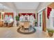 Cozy dining area featuring a round table, elegant chairs, and bright natural lighting at 327 Trestle Way, Conway, SC 29526