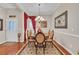 Charming dining room with elegant chandelier, hardwood floors, and ample natural light at 327 Trestle Way, Conway, SC 29526