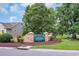 A welcoming entrance to the Heritage Preserve community with stone pillars and lush landscaping at 327 Trestle Way, Conway, SC 29526