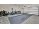 Spacious two car garage featuring an epoxy floor, bright lighting, and ample storage space at 327 Trestle Way, Conway, SC 29526