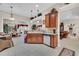 Open-concept kitchen with granite countertops, a breakfast bar, and seamless access to the dining area at 327 Trestle Way, Conway, SC 29526