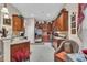 Functional kitchen with wooden cabinets, stainless steel refrigerator, and a charming breakfast nook at 327 Trestle Way, Conway, SC 29526