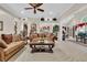 Inviting living room features neutral décor and a seamless transition to the dining and kitchen areas at 327 Trestle Way, Conway, SC 29526