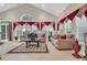 Bright and airy living room features high ceilings, large windows, and comfortable seating at 327 Trestle Way, Conway, SC 29526