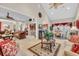 Bright and spacious living room featuring a vaulted ceiling, tile flooring, and comfortable seating arrangements at 327 Trestle Way, Conway, SC 29526