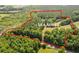 Aerial view of a ~19.4 acre parcel of wooded land bordered by roads and waterways at 3534 Nichols Hwy., Galivants Ferry, SC 29544