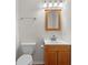 Bathroom featuring wood vanity and mirror, toilet, and tile flooring at 3534 Nichols Hwy., Galivants Ferry, SC 29544