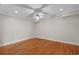 Well-lit bedroom featuring hardwood floors, neutral walls, and a ceiling fan at 3534 Nichols Hwy., Galivants Ferry, SC 29544