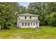 Two story home surrounded by lush trees and landscaping at 3534 Nichols Hwy., Galivants Ferry, SC 29544