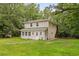 Exterior view of home with covered porch surrounded by mature trees at 3534 Nichols Hwy., Galivants Ferry, SC 29544