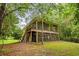 Unique two-story home with a double screened-in porch and wooded surroundings provides a relaxing retreat at 3534 Nichols Hwy., Galivants Ferry, SC 29544