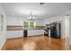 Kitchen with appliances, cabinets, and hardwood floors at 3534 Nichols Hwy., Galivants Ferry, SC 29544