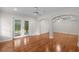 Spacious living room with hardwood floors, archways, and access to a patio at 3534 Nichols Hwy., Galivants Ferry, SC 29544