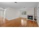 Living room with hardwood floors, fireplace, and built-in shelves at 3534 Nichols Hwy., Galivants Ferry, SC 29544