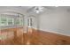 Open-concept living area with hardwood floors, archways, and abundant natural light at 3534 Nichols Hwy., Galivants Ferry, SC 29544