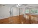 Inviting living room featuring hardwood floors, archways, and open bathroom access at 3534 Nichols Hwy., Galivants Ferry, SC 29544