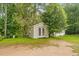 A convenient shed with double doors on a spacious, grassy lot offers ample storage space at 3534 Nichols Hwy., Galivants Ferry, SC 29544