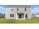 Back exterior view of a two-story home showing covered patio and neat lawn at 3542 Ashridge Way, Conway, SC 29526